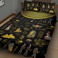 Black quilt bed set with gold hieroglyphs, pharaoh and bird figures, and matching pillows