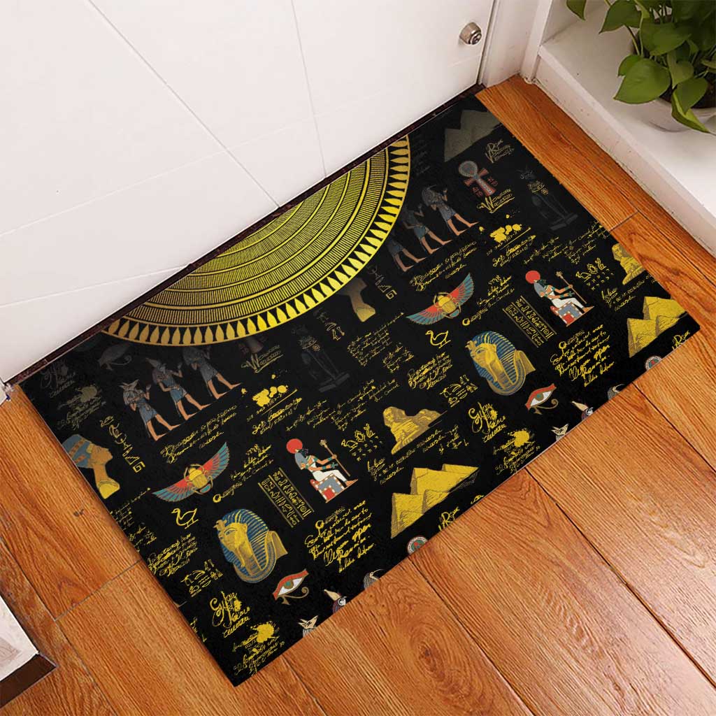 Black rubber doormat with Egyptian hieroglyphs, pyramids, and sun-disk design