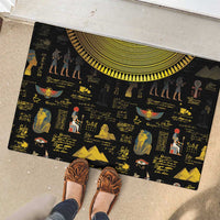 Black rubber doormat with Egyptian figures, hieroglyphs, and yellow sun-disk border