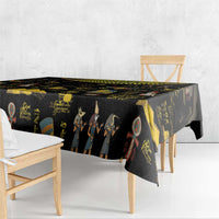 Black Ancient Egypt tablecloth draped on table with gold and colorful hieroglyph motifs