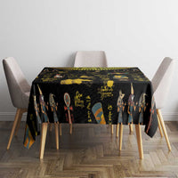Black Ancient Egypt tablecloth centered on round table with gold hieroglyph pattern
