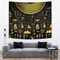 Black tapestry with gold Egyptian figures and hieroglyph-style symbols, crescent border at top