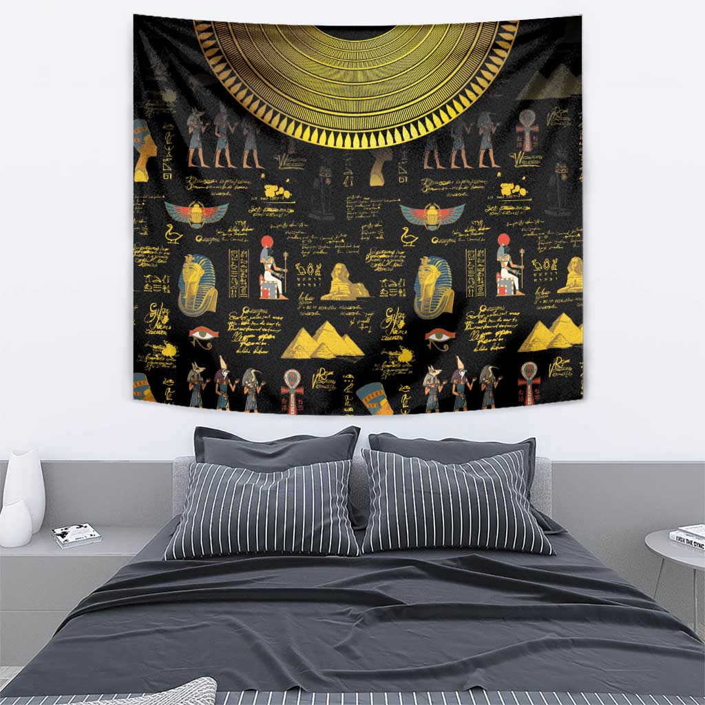 Black Egyptian wall tapestry with gold hieroglyph text, statues, and crescent decorative band