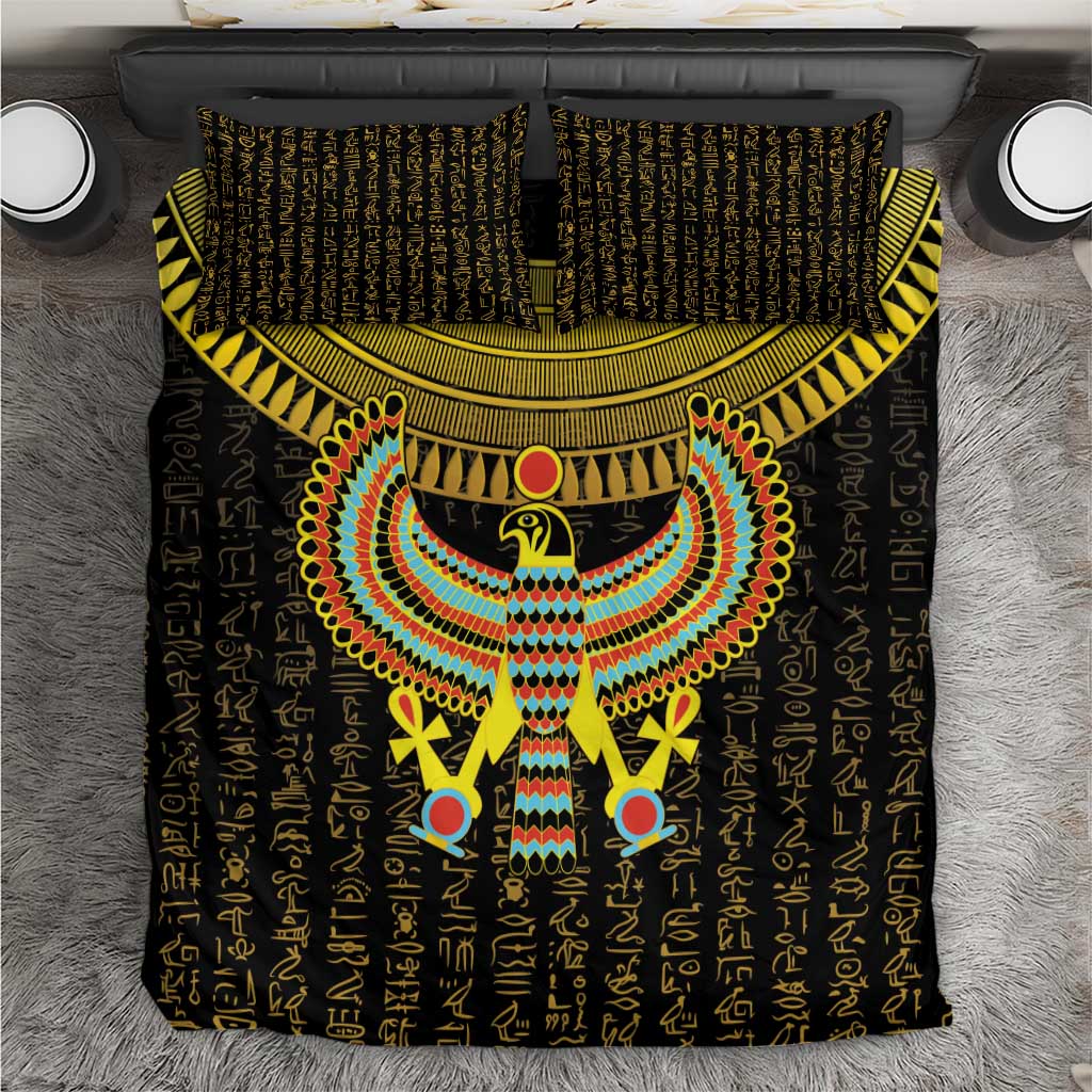 Black bedding set with gold Horus falcon emblem and patterned geometric stripes