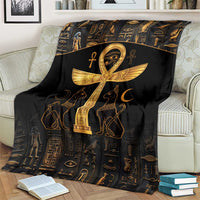 Black throw blanket with gold Ankh cross and Eye of Horus, centered on couch