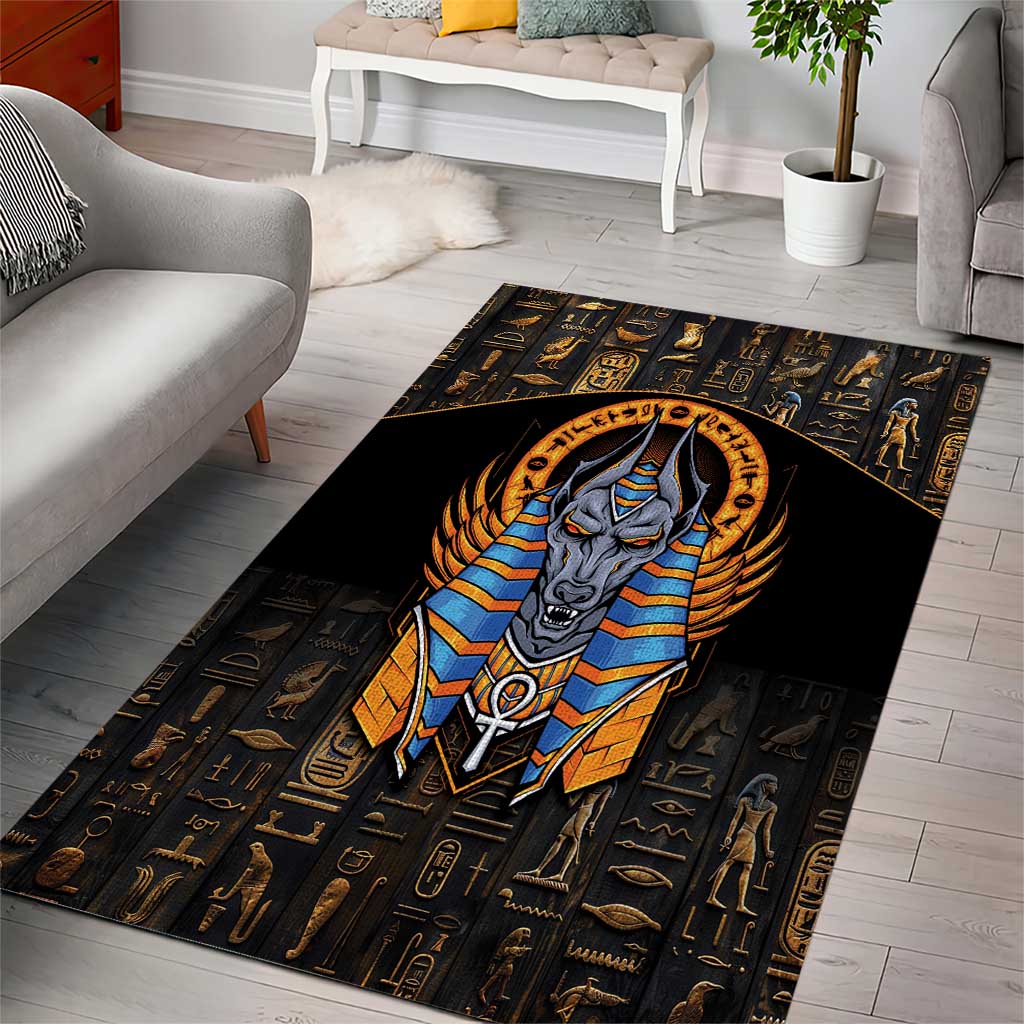 Black Egyptian area rug featuring a centered blue Anubis face inside a gold circle