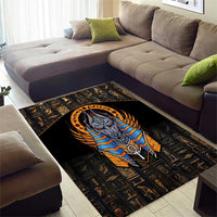 Black Egyptian Anubis area rug with winged headdress, blue stripes, and gold symbols