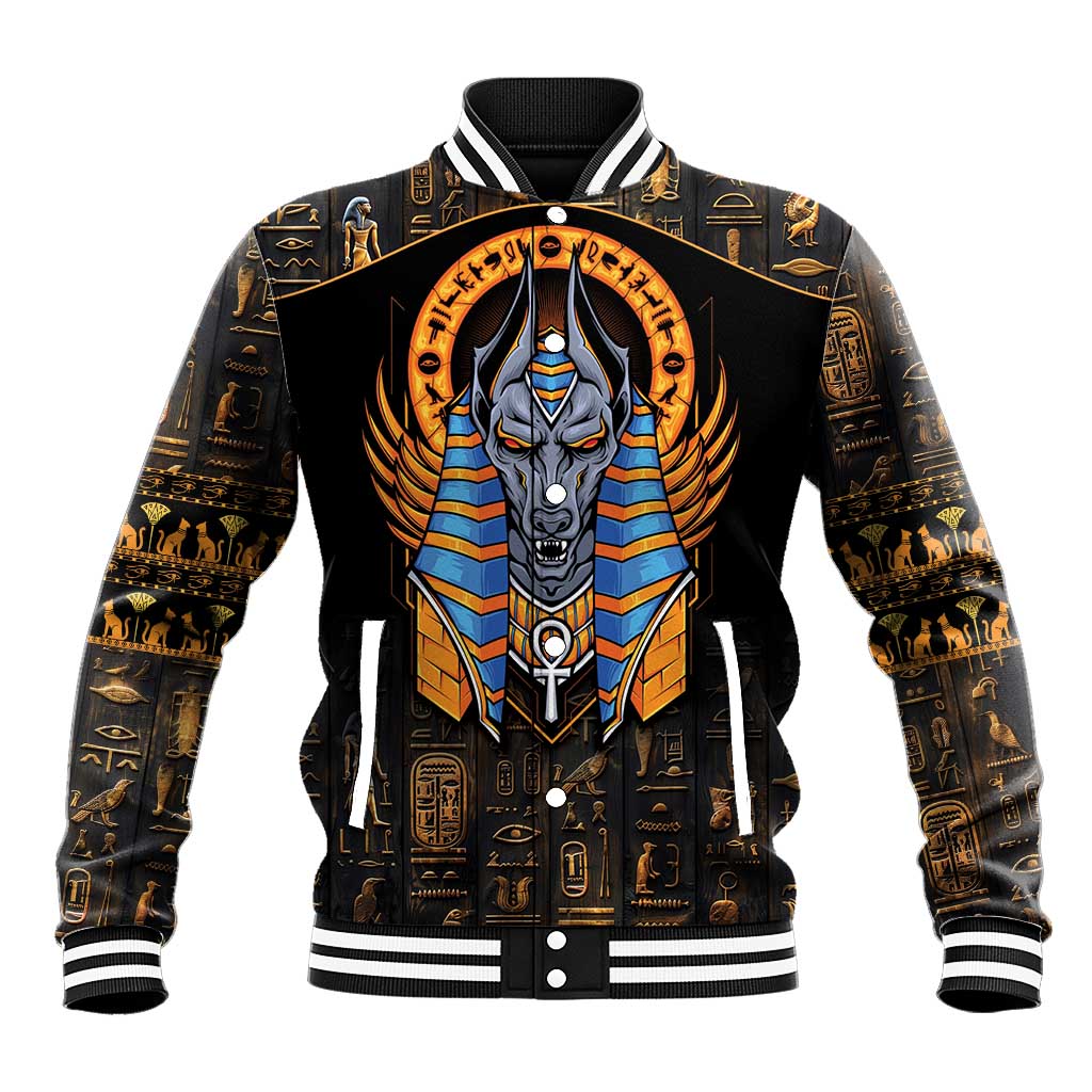 Black baseball jacket with front Anubis emblem, gold hieroglyph patterns and striped ribbed cuffs