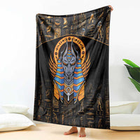 Black blanket with central Anubis figure, gold hieroglyph symbols, and blue-striped collar