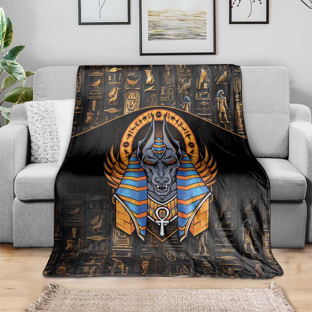 Black blanket with centered Anubis artwork over a pattern of Egyptian hieroglyphs