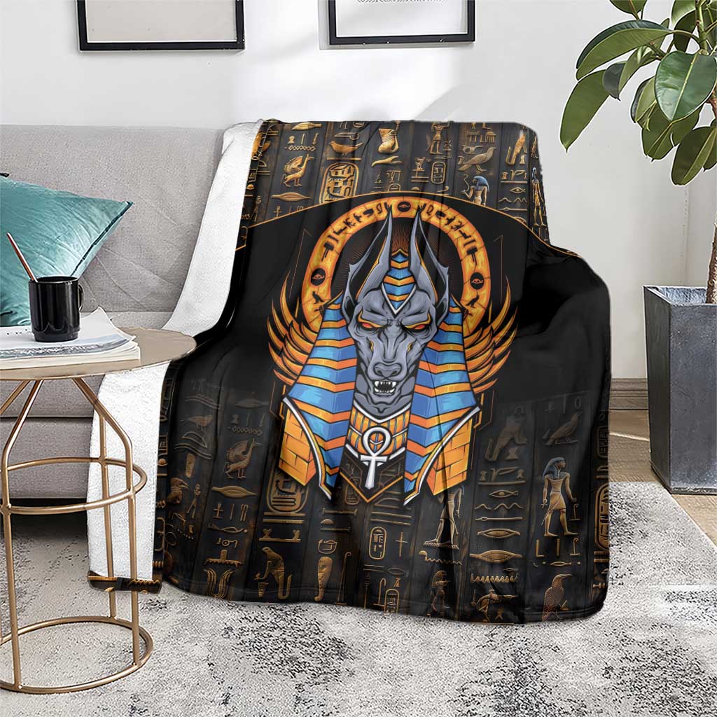 Black blanket featuring bold Anubis portrait, gold Egyptian icons, and blue collar accents