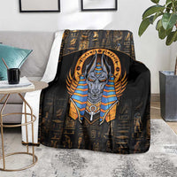 Black blanket featuring bold Anubis portrait, gold Egyptian icons, and blue collar accents