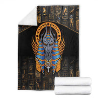 Black Egyptian Anubis blanket with front-facing Anubis graphic over gold hieroglyphs