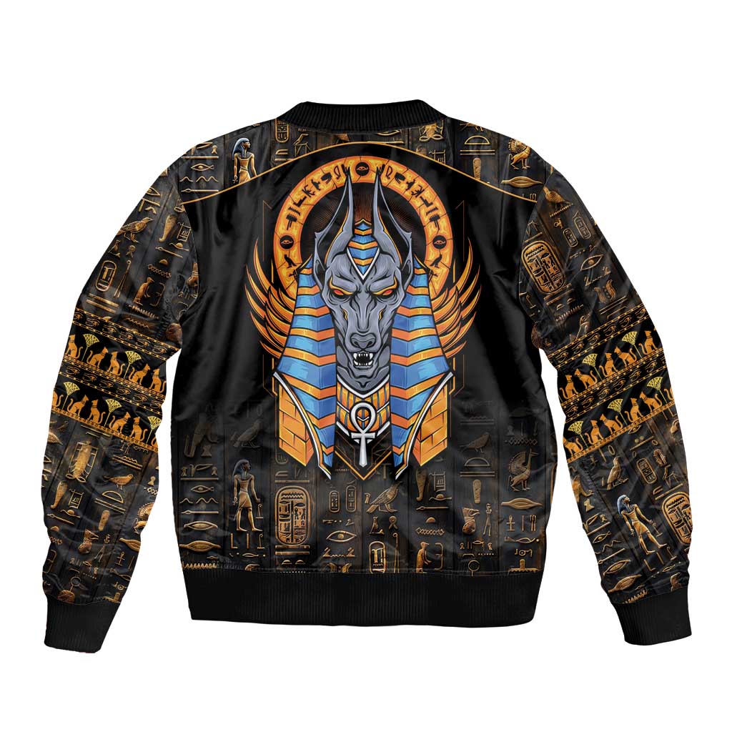 Black bomber jacket with large Anubis emblem, gold hieroglyph print, ribbed trim