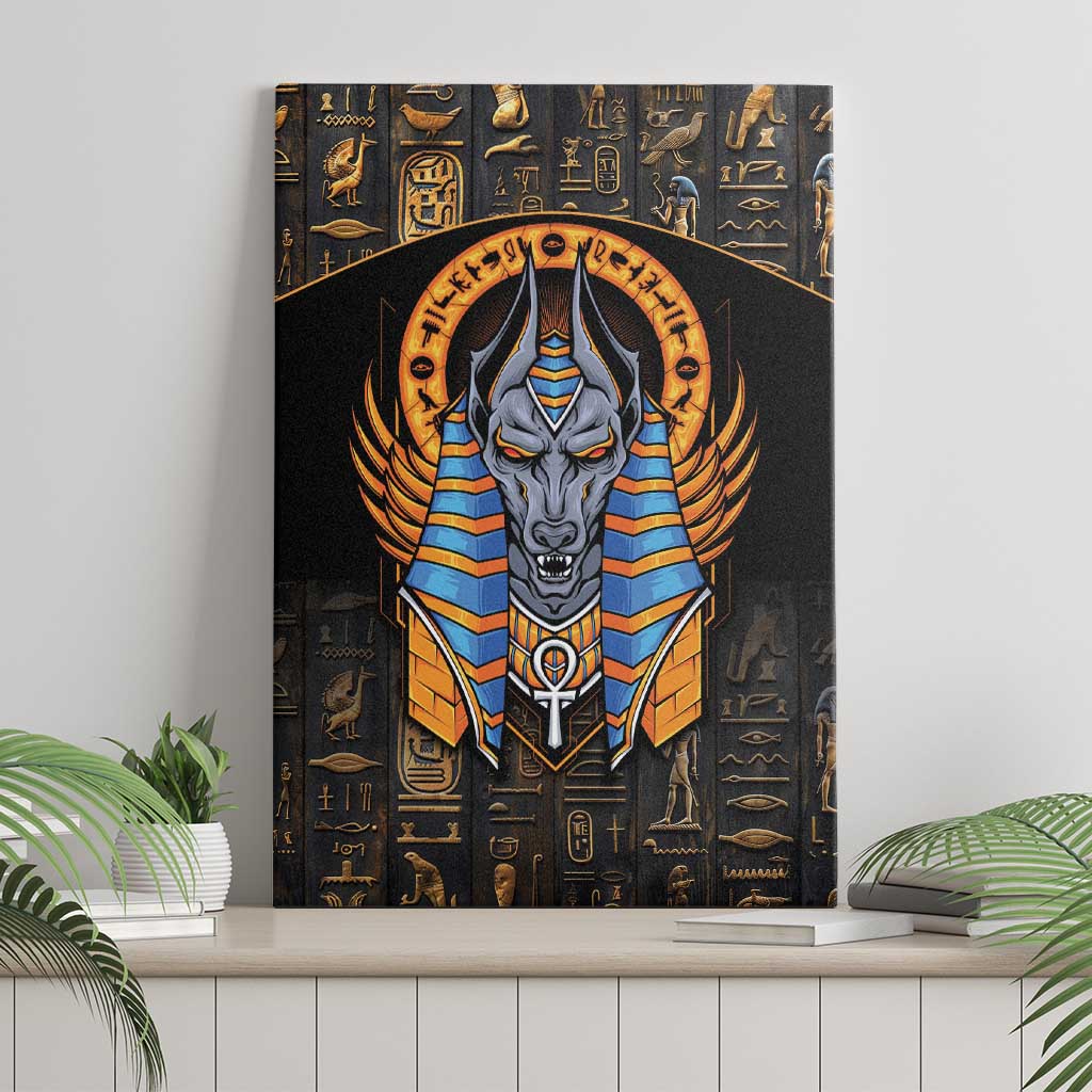 Black canvas wall art of Anubis with blue-and-gold winged headdress, straight view