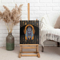 Black canvas wall art of Anubis with blue-and-gold winged headdress, on easel