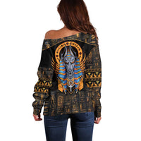 Black off-shoulder sweater with large Anubis graphic on back, long sleeves