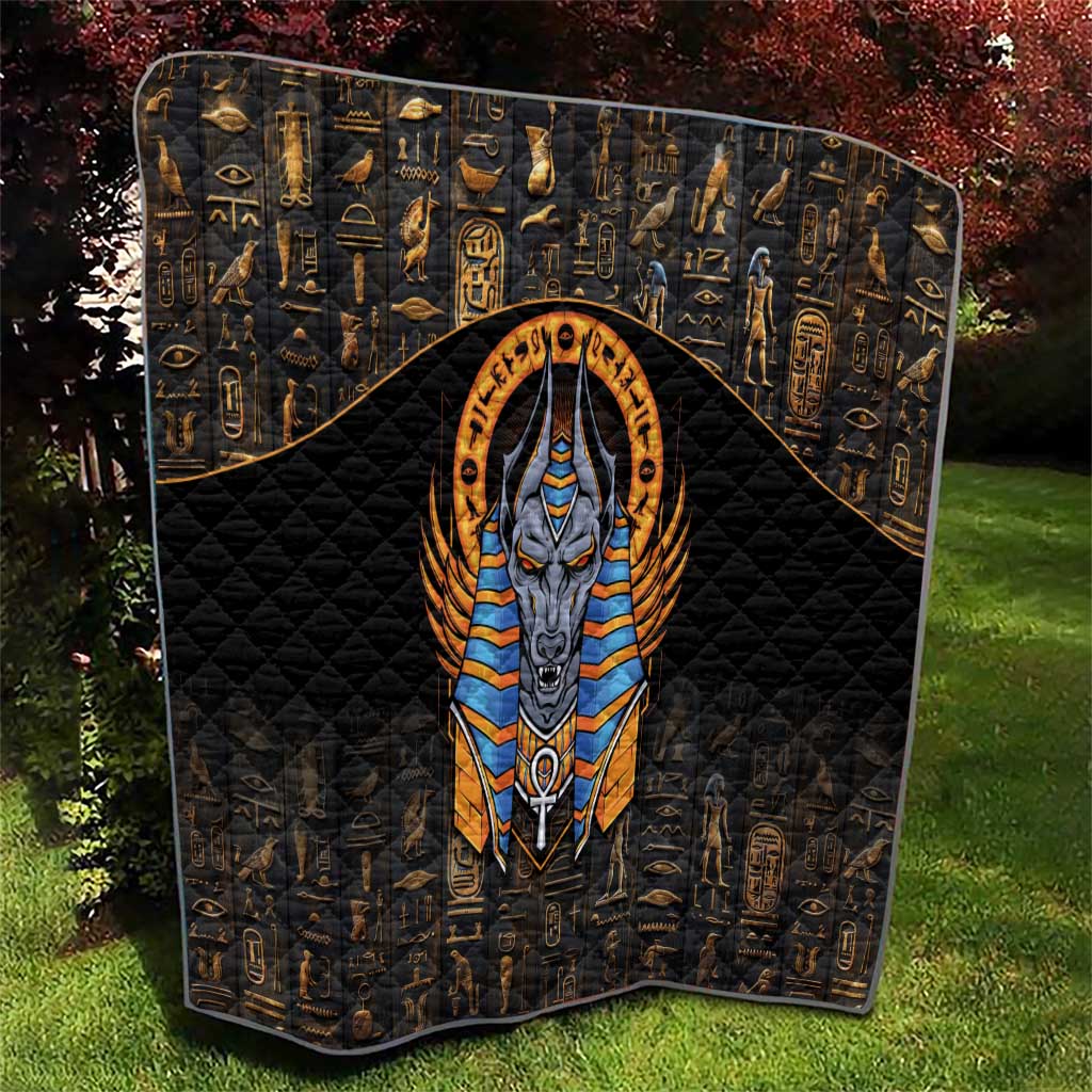 Black Egyptian Anubis quilt with gold hieroglyph border and central Anubis in orange halo