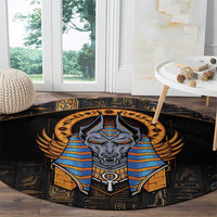 Black round rug with large Anubis face and blue-and-gold striped armor illustration