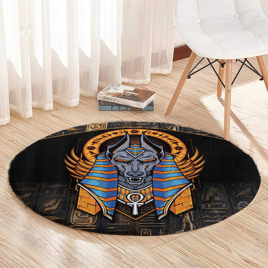 Black round area rug showing Anubis in blue and gold armor with Egyptian symbols