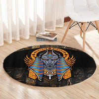 Black round area rug showing Anubis in blue and gold armor with Egyptian symbols