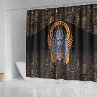 Black shower curtain featuring a tall Anubis figure in gold and blue against hieroglyphs