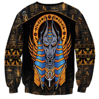 Black unisex sweatshirt with centered Anubis head graphic, blue-and-gold striped chest armor