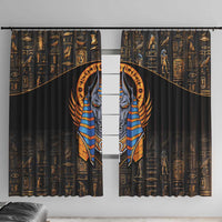 Black curtain panels with gold hieroglyph pattern and central Anubis face graphic