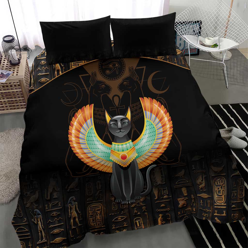 Black comforter with winged gray cat graphic, Egyptian symbols, and two black pillows