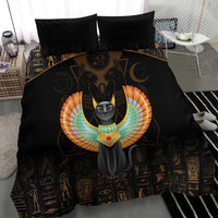 Black comforter with winged gray cat graphic, Egyptian symbols, and two black pillows