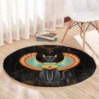 Black round area rug with central winged Egypt cat and colorful headdress on dark base