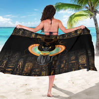 Black sarong with winged cat graphic and gold hieroglyph pattern, worn from behind