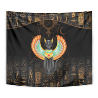 Close-up dark winged cat tapestry with gold hieroglyph patterns and centered cat