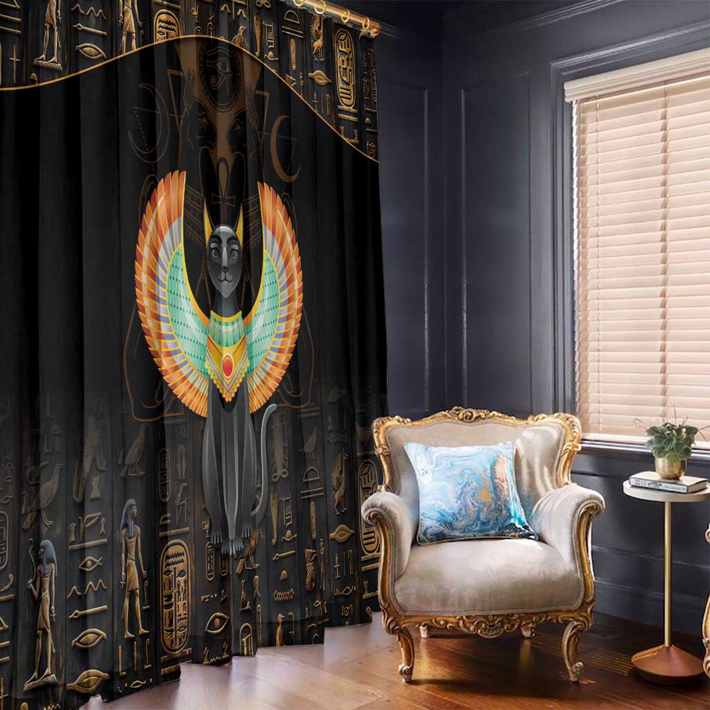 Black curtain with winged cat and Egyptian symbol print; gold lines across panels