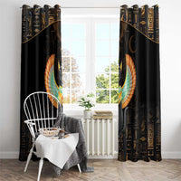 Black curtain pair with large winged cat emblem centered; gold Egyptian characters