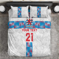 White custom bedding set with blue geometric Luxembourg flag center stripe, pillows included