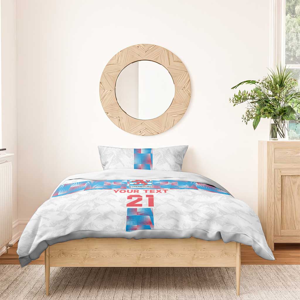 White duvet and pillowcases with blue Luxembourg flag stripe, “YOUR TEXT” and “21”