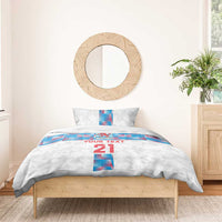 White duvet and pillowcases with blue Luxembourg flag stripe, “YOUR TEXT” and “21”