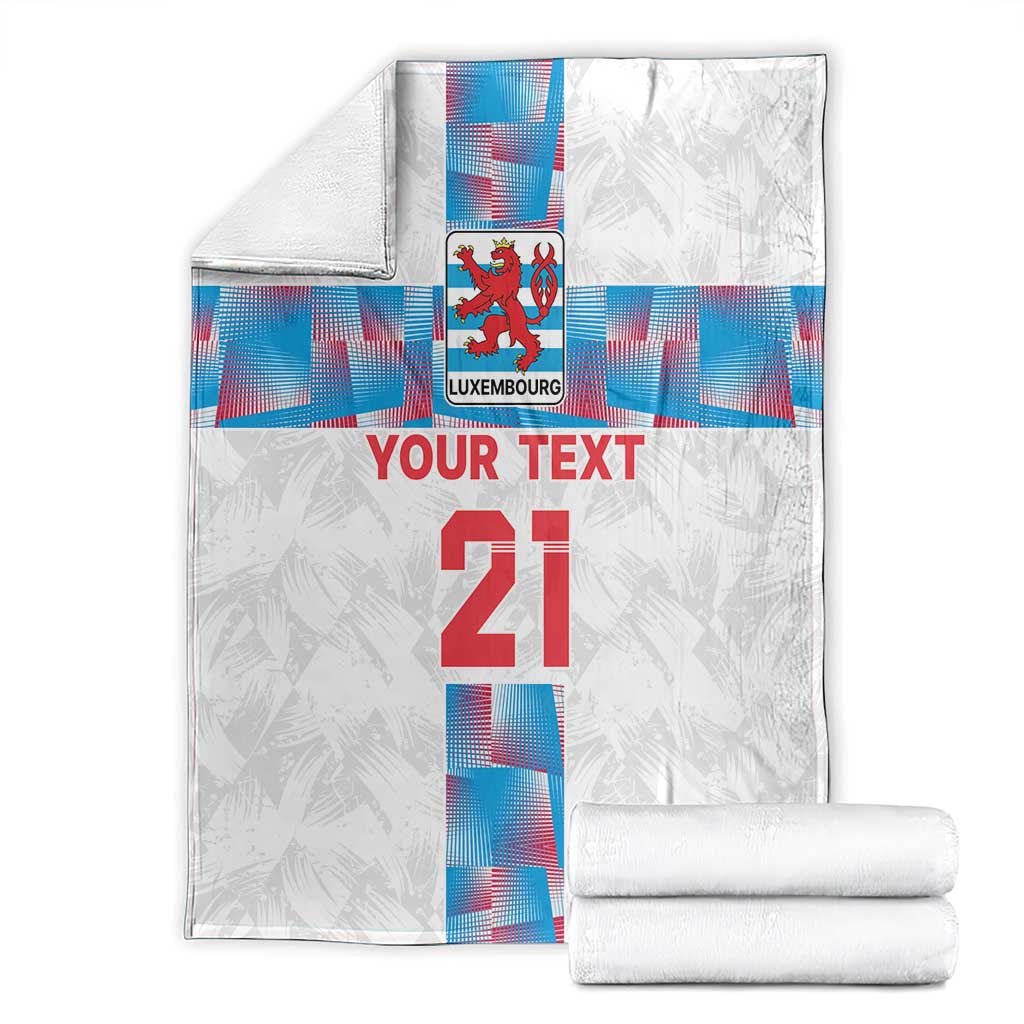Custom football blanket, white with Luxembourg crest, 'YOUR TEXT' 21, folded with rolled towels
