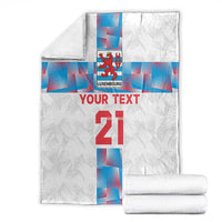 Custom football blanket, white with Luxembourg crest, 'YOUR TEXT' 21, folded with rolled towels