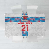 White tablecloth with blue and red sports graphic and large red “21” center panel