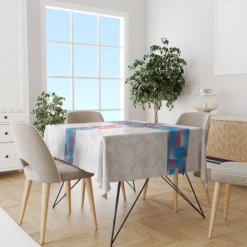 White tablecloth with blue-and-red check and stripe pattern on a dining table