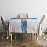 White tablecloth on a small table with blue-and-red vertical graphic panel