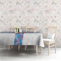 White tablecloth with blue-and-red center panel over a dining table