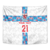White close-up football tapestry with Luxembourg crest and blue cross beside red “21”.