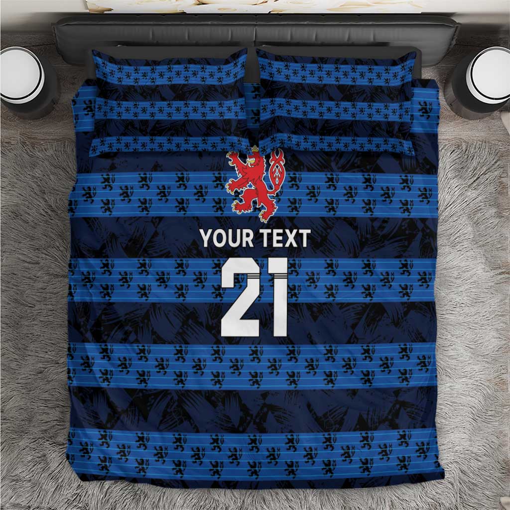 Blue football bedding set with striped pattern, crest, and large number 21 on duvet
