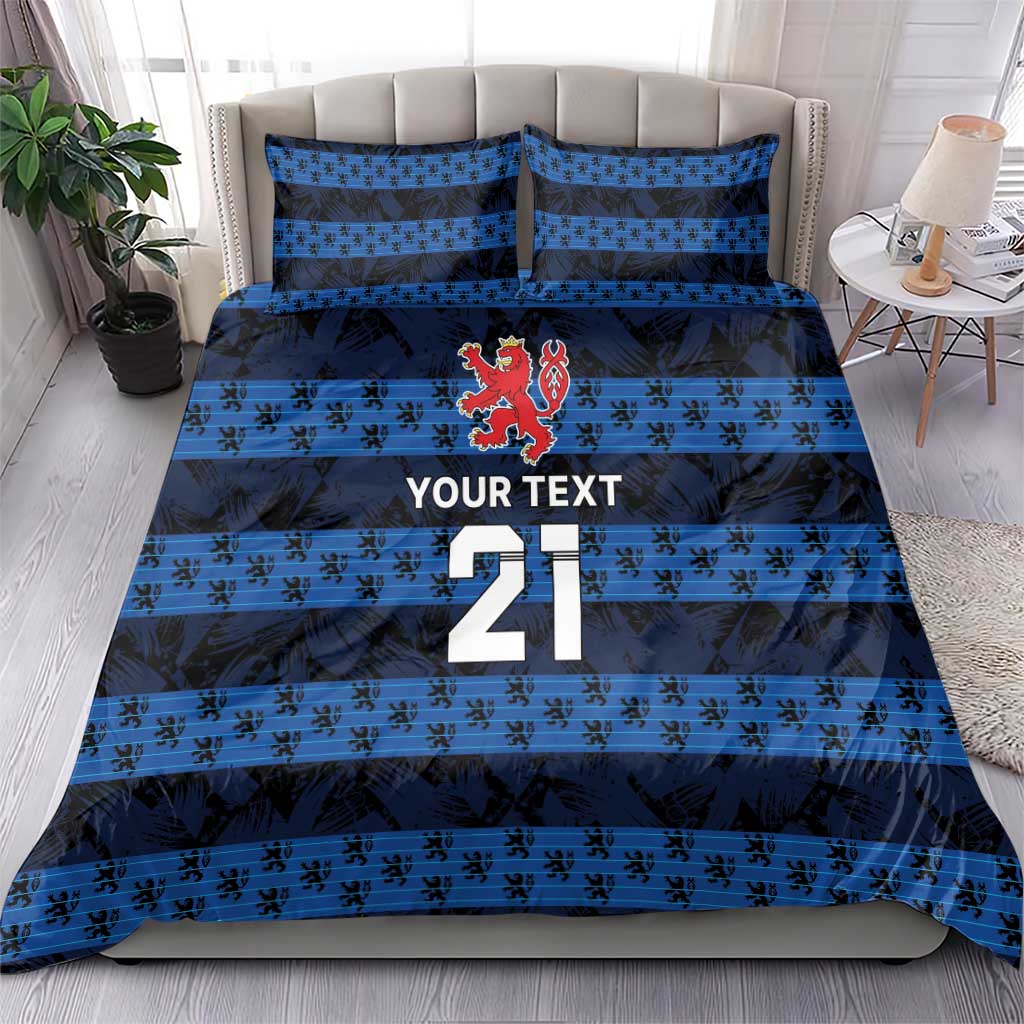 Blue football bedding set with duvet and pillowcases featuring crest, stripes, and number 21