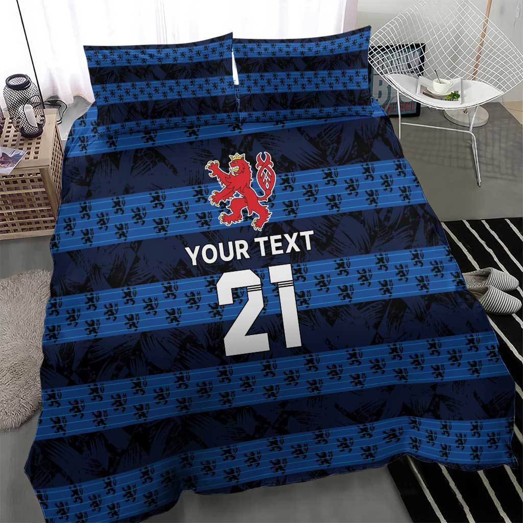 Blue football bedding set showing duvet and pillows with striped design, crest, and number 21