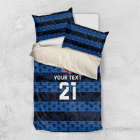 Blue football bedding set laid flat: duvet with stripes, crest, and number 21 with YOUR TEXT