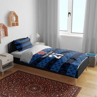 Blue football bedding set on bed frame: duvet with crest, stripes, and number 21